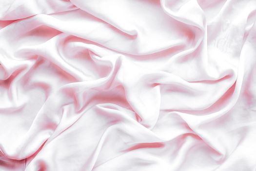 Elegant fabric texture, abstract backdrop and modern pastel colours concept - Pink soft silk waves, flatlay background