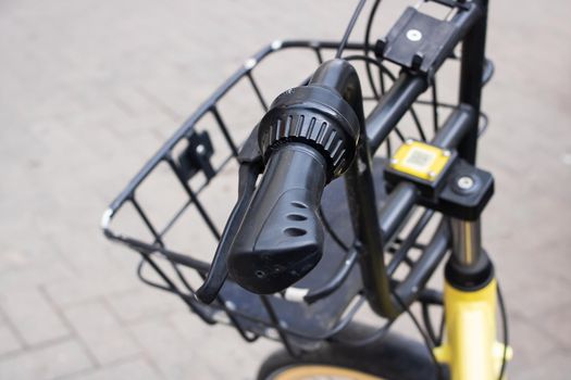 Handlebar and bicycle basket on the road close up