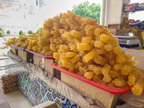 Oriental sweets Navat, crystal sugar, from grape juice are sold at the bazaar.