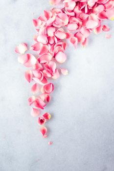 Art of flowers, wedding invitation and nature beauty concept - Rose petals on marble stone, floral background