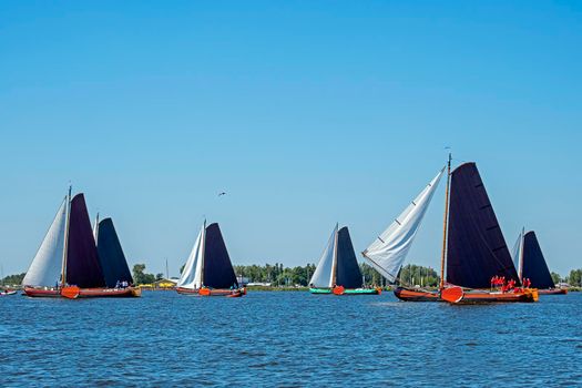 Traditional Frisian wooden sailing ships in a yearly competition in the Netherlands