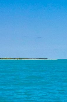 Boat trip tour from Cancun to Island Mujeres Isla Contoy and Whale shark tour with natural tropical seascape panorama and blue turquoise and green clear water view from boat in Quintana Roo Mexico.