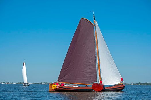 Traditional Frisian wooden sailing ships in a yearly competition