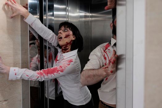 Couple of zombies escaping elevator to attack people in business office, walking dead horror apocalypse with devil possessed monsters. Eerie dramatic corpses brain eating walkers at workplace.