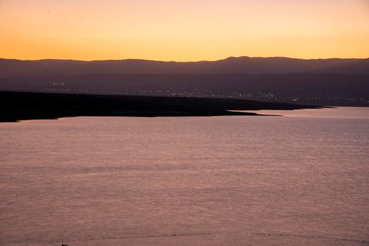 Orange sunrise reflecting off of the Dead Sea. High quality photo