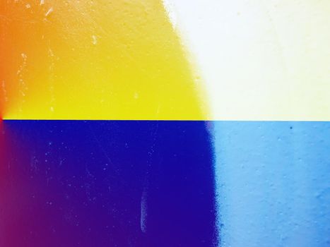 Closeup of colorful texture and background in Ukraine flag color - yellow and blue. Ukraine flag paint shading with image of national flag. Independence Day banner background style.