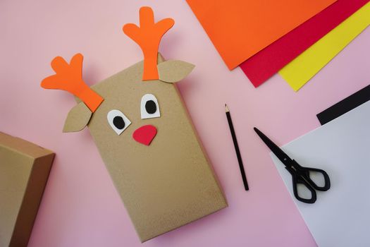 Step 6. Making a gift package in the form of a Christmas deer. High quality photo