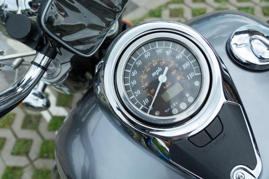 Top view of the speedometer on the fuel tank of a motorcycle