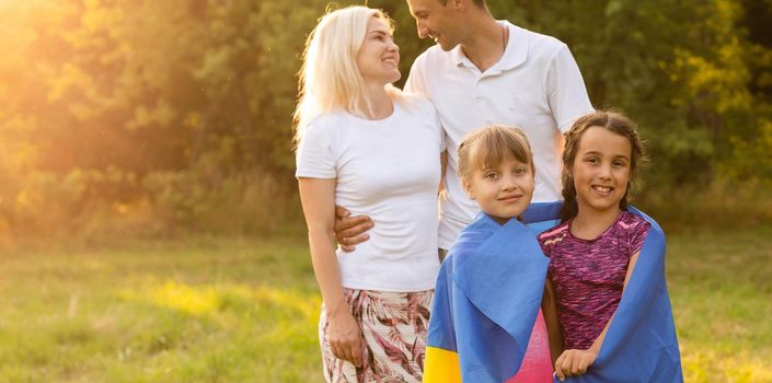 family with the flag of ukraine. Happy Independence Day of Ukraine. National Flag Day. Love for the homeland and symbols. Copy space