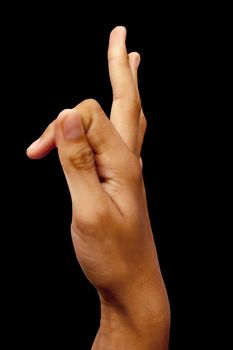 Side view of a male hand demonstrating Vayu mudra isolated on black background.