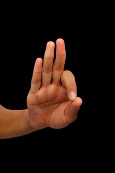 Shot of a male hand showing Gyan mudra isolated on black background.