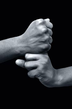 Shot of a male hand demonstrating Kundalini Mudra isolated on black background.