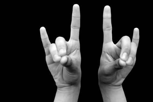 Shot of male hands demonstrating Apana mudra with two hands isolated on a black background.