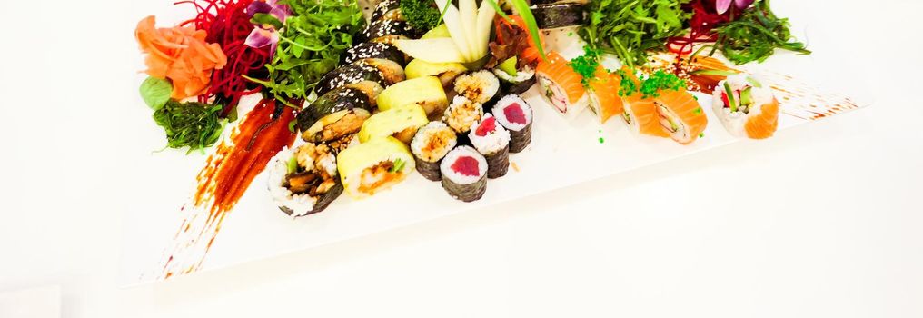 Food, travel and healthy eating concept - Japanese sushi in a restaurant at lunch time, asian cuisine