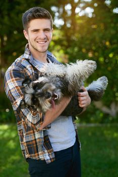 This is what unconditional love looks like. a man playing with his dog outside