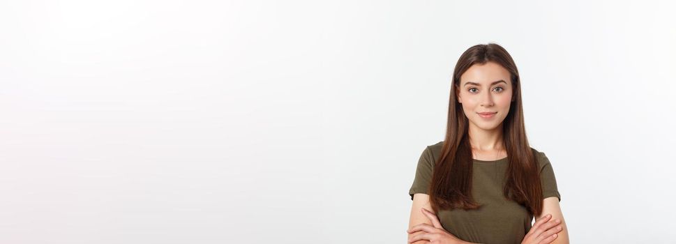 Portrait of a beautiful young woman looking at the camera and smiling, isolated on a white background