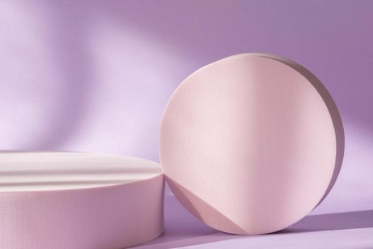 Cosmetic product presentation with shadows and light from windows. Lilac backdrop with pink round podium, display, mockup. Window natural shadow overlay effect on purple surface, spring pastel theme