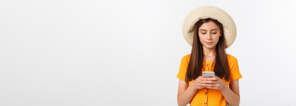 Woman sending a sms on cell phone, isolated on white background.