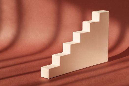 Cosmetic art deco stair podium display pedestal stand. Fashion geometric staircase backdrop for product presentation with shadow from sun. Abstract minimal template stage. Modern scene mockup showcase
