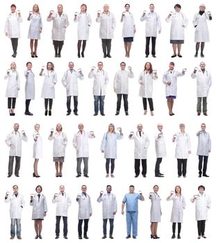 full length group of doctors showing badge isolated on white background