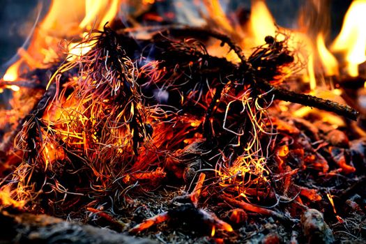 a large open-air fire used as part of a celebration, for burning trash, or as a signal.