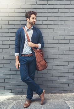 Effortlessly stylish. a stylishly dressed businessman outdoors