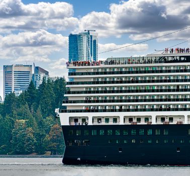 Huge ocean cruise ship leaving Vancouver's port for the world cruise in the ocean