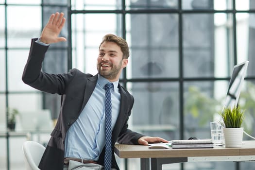 Hello. Portrait Of Cheerful Middle Aged Business Man Waving Hand Smiling