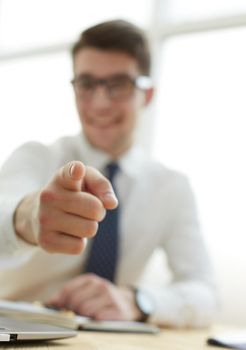 businessman pointing his finger to you at office