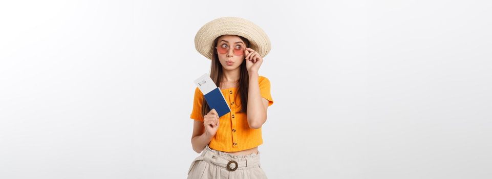 Portrait of happy tourist woman holding passport on holiday on white background