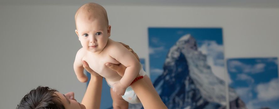 picture of happy mother with baby in hands.