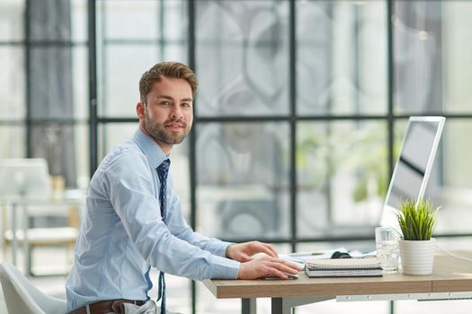 Young businessman working at office