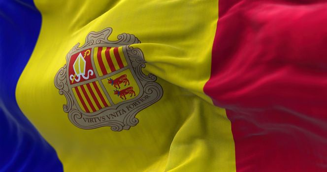 Close-up view of the andorran national flag waving in the wind. Andorra is a sovereign landlocked microstate on the Iberian Peninsula. Fabric textured background. Selective focus