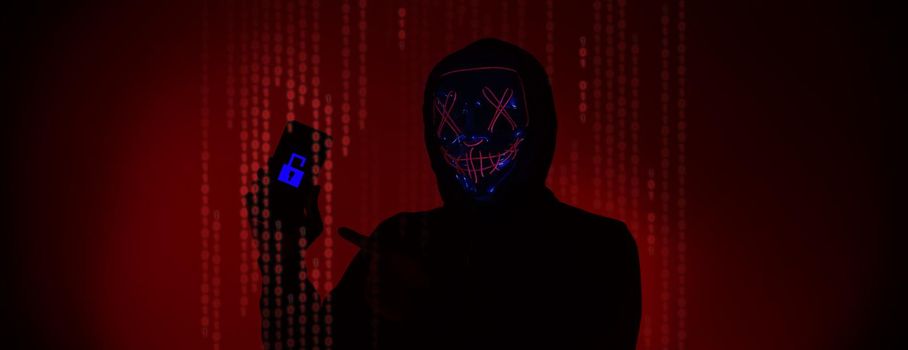 Digital security Concept. Anonymous hacker with mask holding smartphone hacked. Personal and Cyber data security in mobile phone stolen by man in mask. Represent digital privacy protection concept.