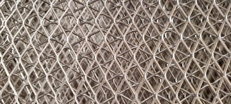 metal screen with a silver geometric shape, forming abstract lines