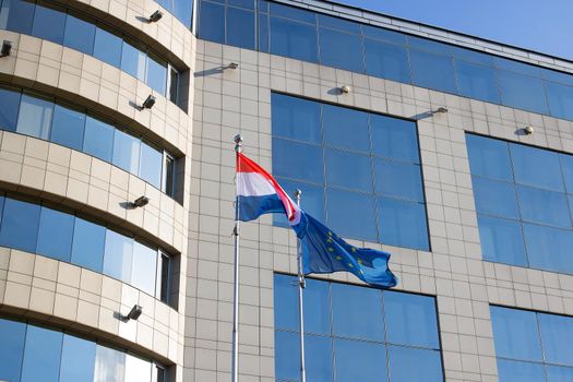 Belarus, Minsk - 18 august, 2022: Flags of the EU and the Netherlands at the office building