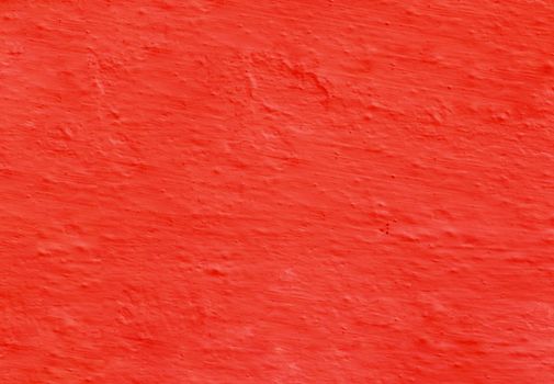 Abstract panoramic image of a red clay wall. Texture from old red uneven plaster.