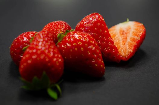 strawberries on black background