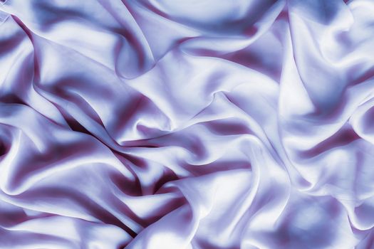 Elegant fabric texture, abstract backdrop and modern pastel colours concept - Purple soft silk waves, flatlay background