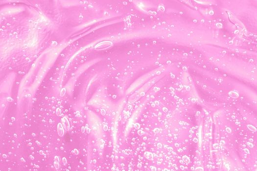 Hyaluronic acid with retinol and ceramide swatch. Pink toner smear smudge texture. Gel serum liquid cosmetics, cream with collagen sample. Jelly cleanser cosmetic product. Close-up, macro.