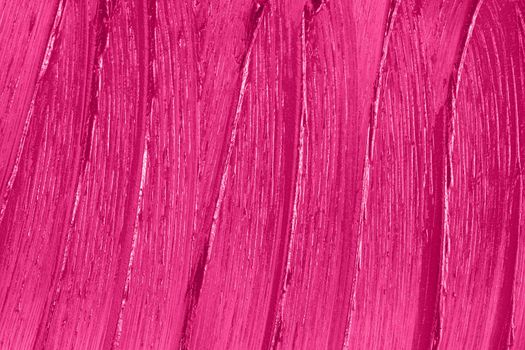 Beauty product sample closeup. Purple cosmetics smear pattern. Liquid lipstick cosmetic. Pink swatch matt backdrop. Makeup fashionable creamy texture stroke