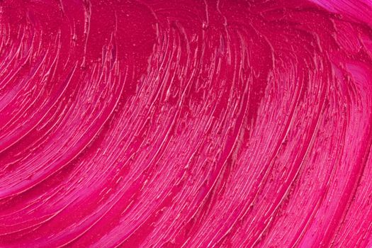Purple cosmetics smear pattern. Beauty product sample closeup. Liquid lipstick cosmetic. Pink swatch matt backdrop. Makeup fashionable creamy texture stroke