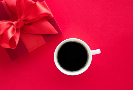 Romantic celebration, lifestyle and birthday present concept - Luxury beauty gift box and coffee on red, flatlay