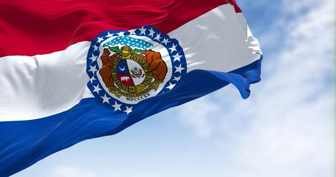 The US state flag of Missouri waving in the wind. Missouri is a state in the Midwestern region of the United States. Democracy and independence.