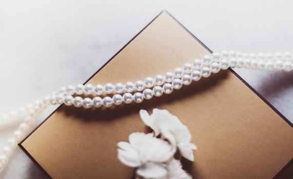 Valentine's day ideas, luxury shopping and holiday inspiration concept - Pearl jewellery in a vintage golden gift box