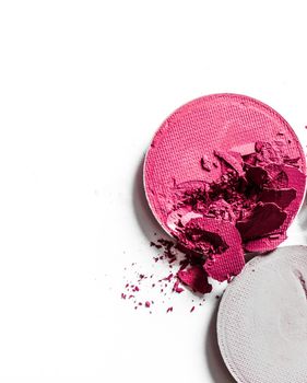 Beauty texture, cosmetic product and art of make-up concept - Crushed eyeshadows and lipstick isolated on white background