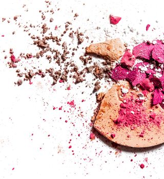 Beauty texture, cosmetic product and art of make-up concept - Crushed eyeshadow palette and powder close-up isolated on white background