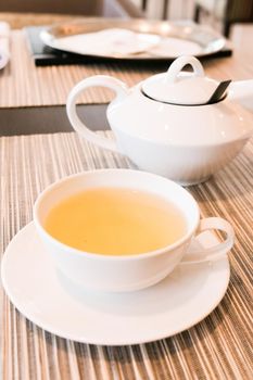 Healthy nutrition, relax and detox concept - Green herbal tea in a restaurant, five o'clock