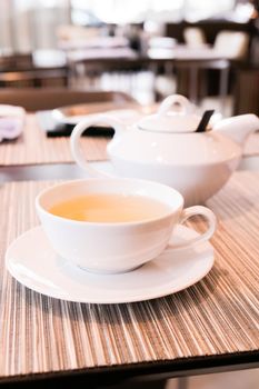 Healthy nutrition, relax and detox concept - Green herbal tea in a restaurant, five o'clock