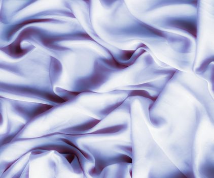 Elegant fabric texture, abstract backdrop and modern pastel colours concept - Purple soft silk waves, flatlay background